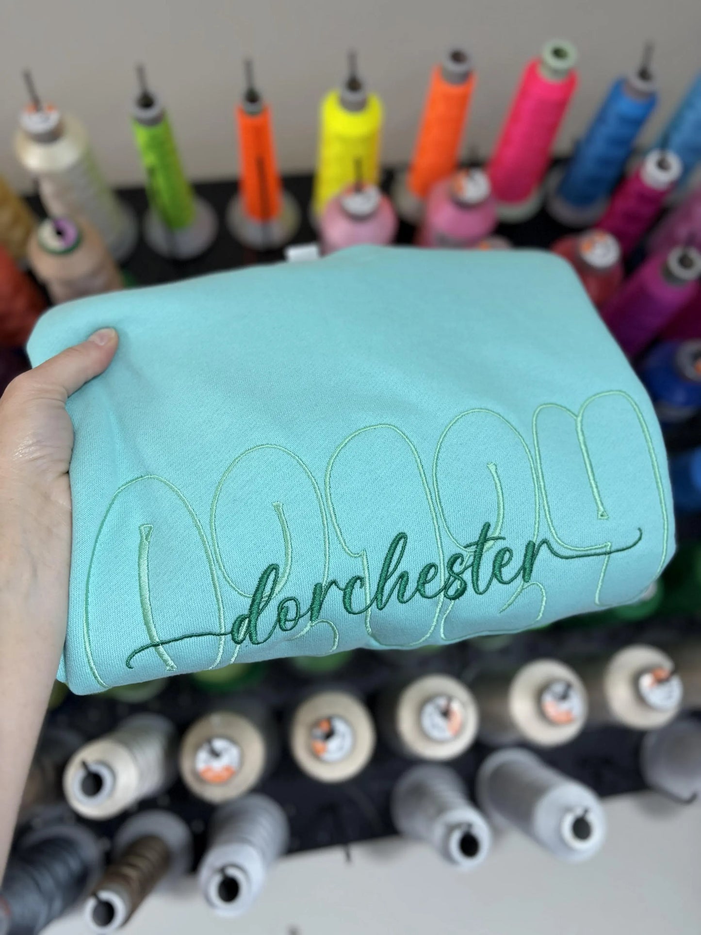 Outline font with overlay embroidered crew
